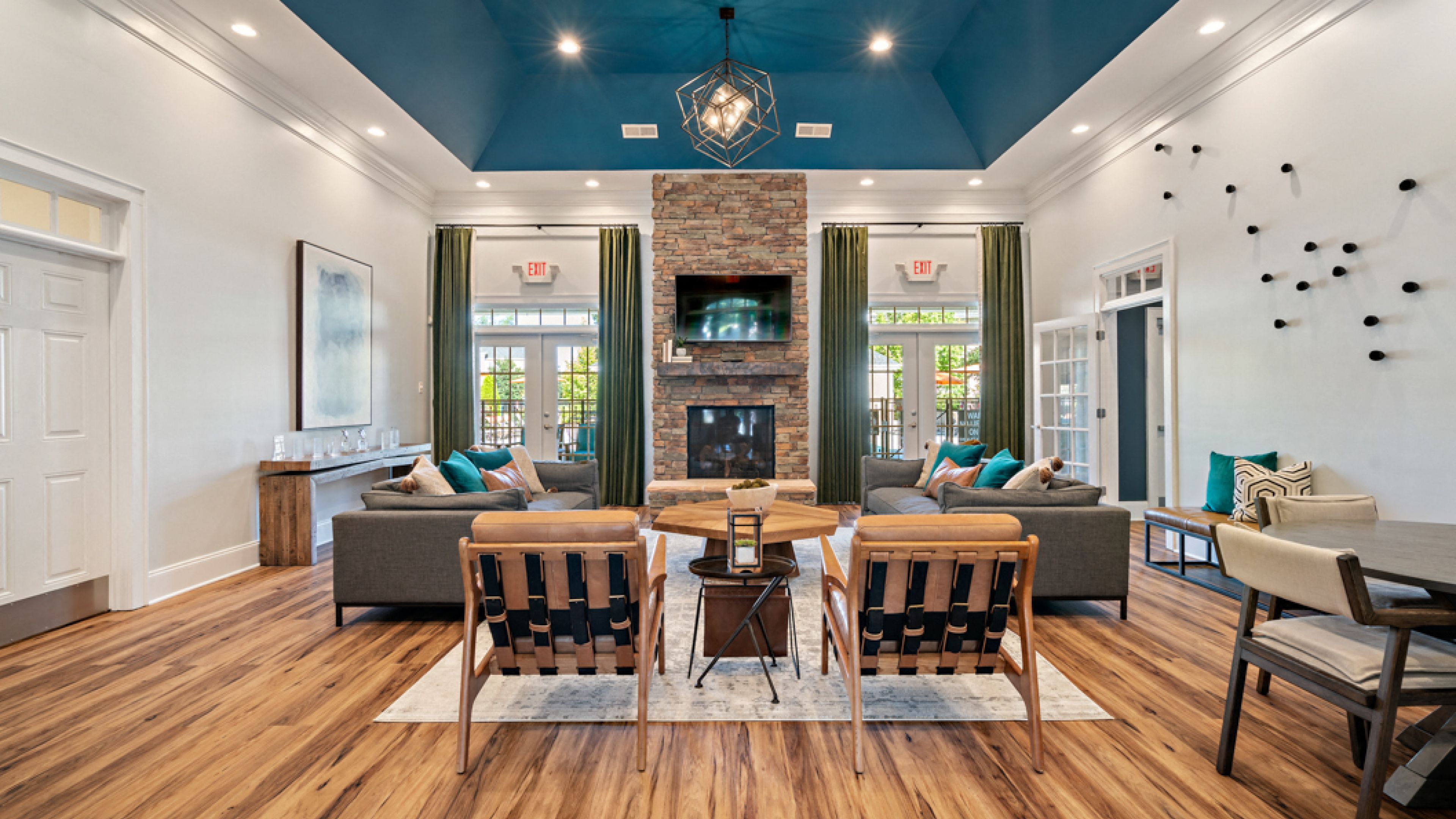 Hawthorne at Horse Pen Creek resident clubhouse amenity with seating area, fireplace, and TV