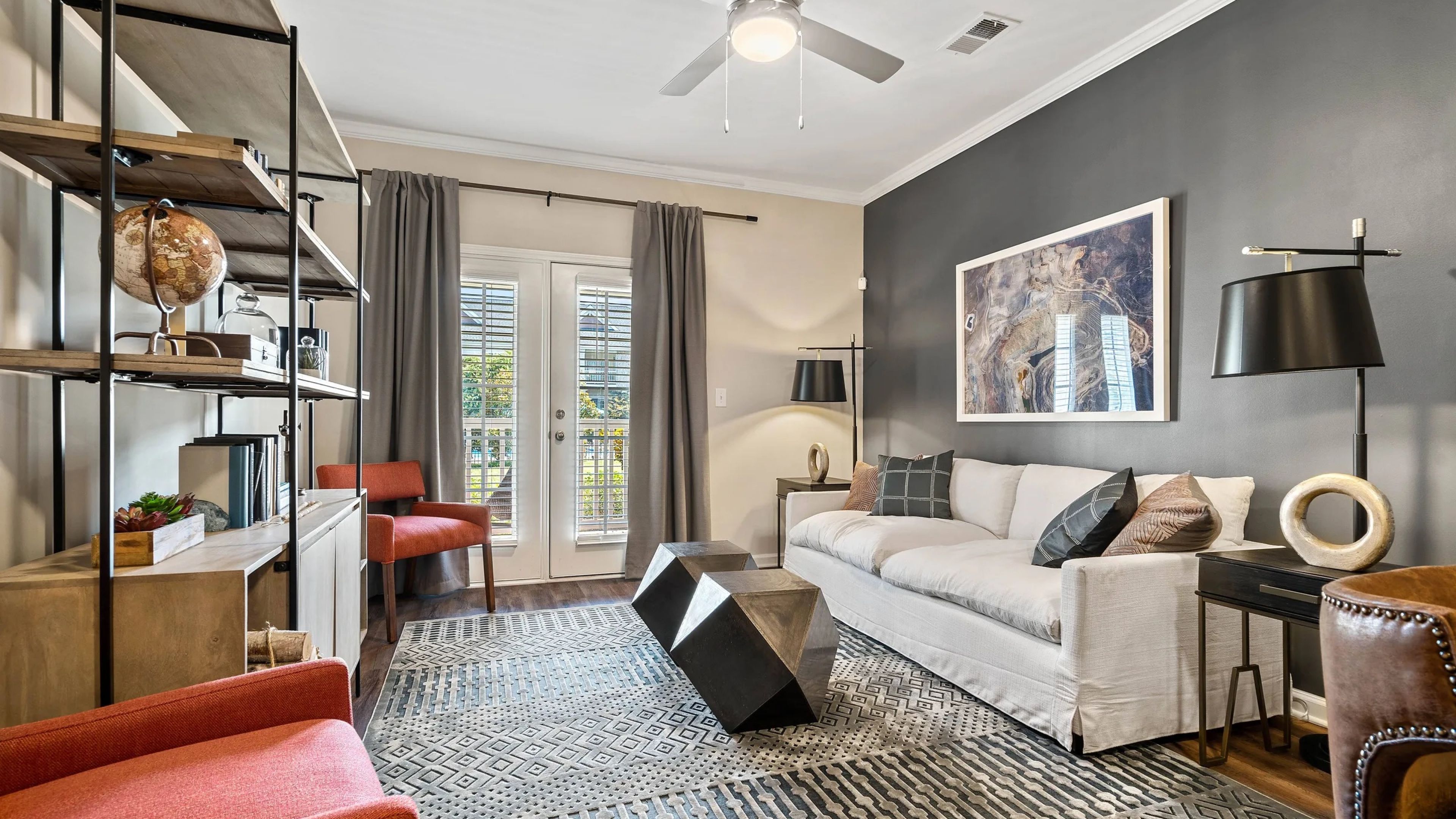 Hawthorne at Horse Pen Creek apartment living space and kitchen with small dining table, kitchen peninsula, and stainless steel appliances