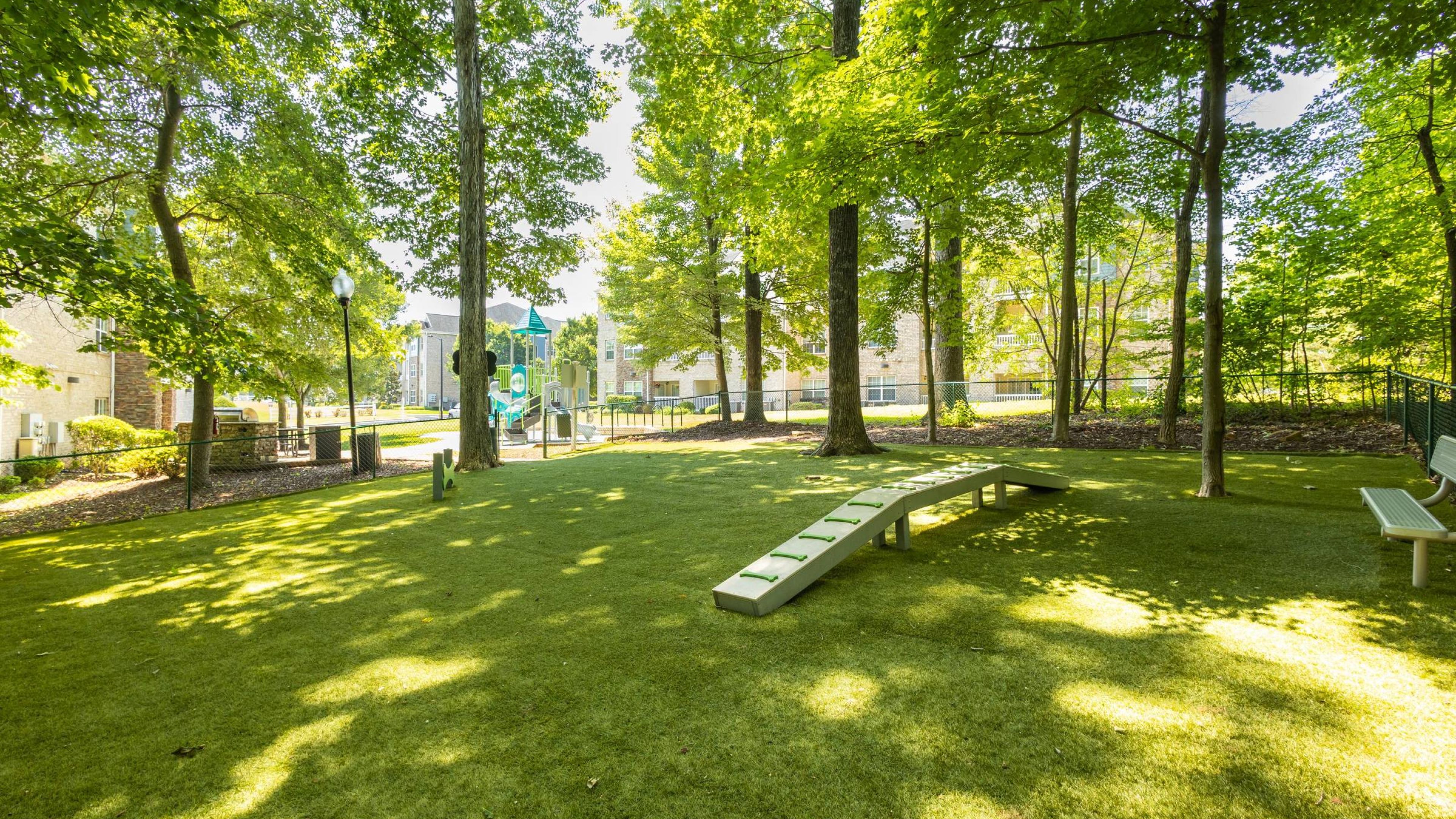 Hawthorne at Horse Pen Creek outdoor dog park space with surrounding benches