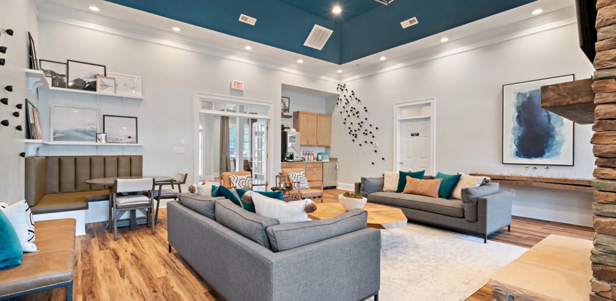 Hawthorne at Horse Pen Creek apartment patio with a view of community exterior, large green lawn and outdoor pool area