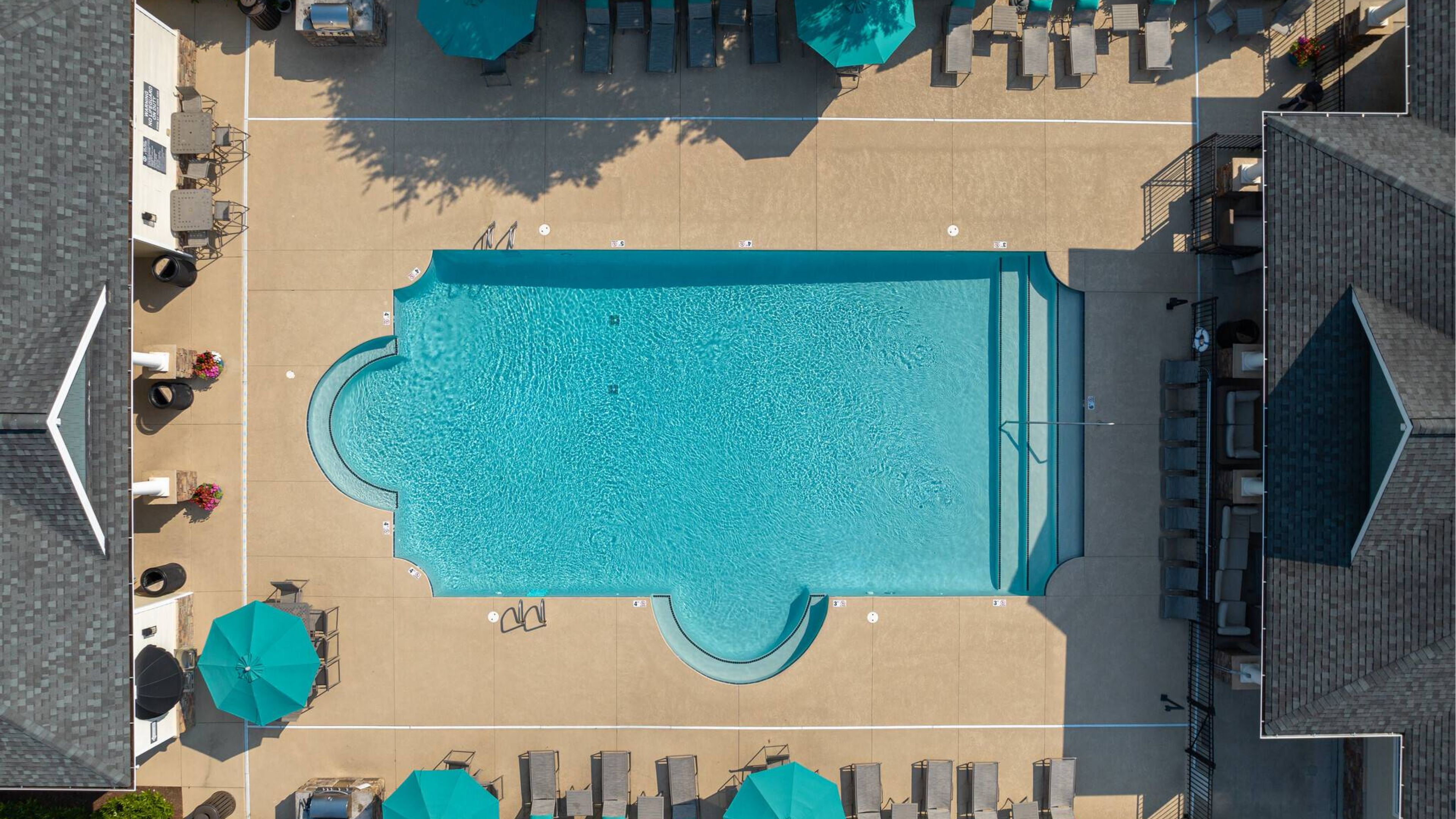 Hawthorne at Horse Pen Creek uxury outdoor pool with lounge chairs and surrounding seating